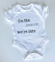 Baby onesie slogan 'I'm the reason we're late'