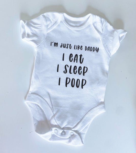 Baby onesie slogan 'I'm just like daddy'