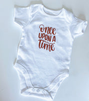 Baby onesie slogan 'Once upon a time'